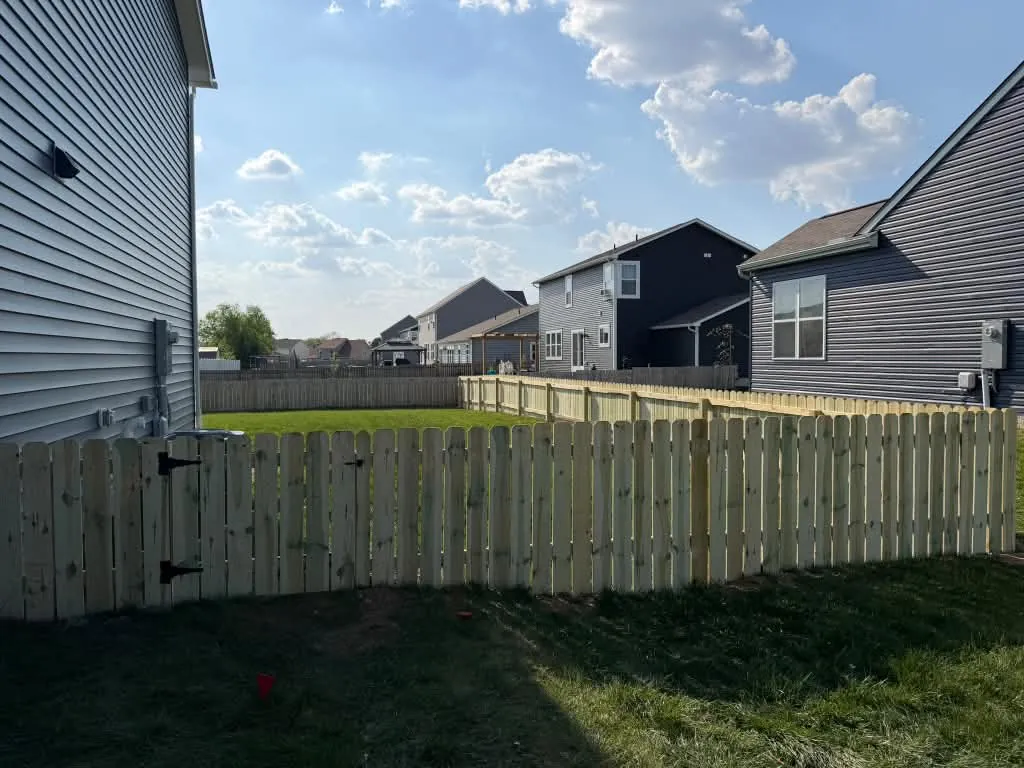 Backyard with a new wood privacy fence