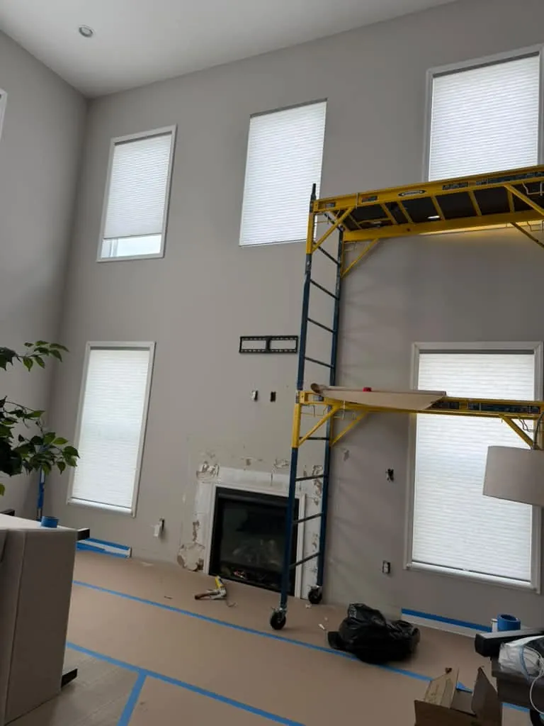 Living room wall under construction with scaffolding
