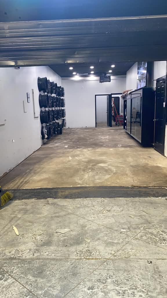 Garage before with bare concrete floor