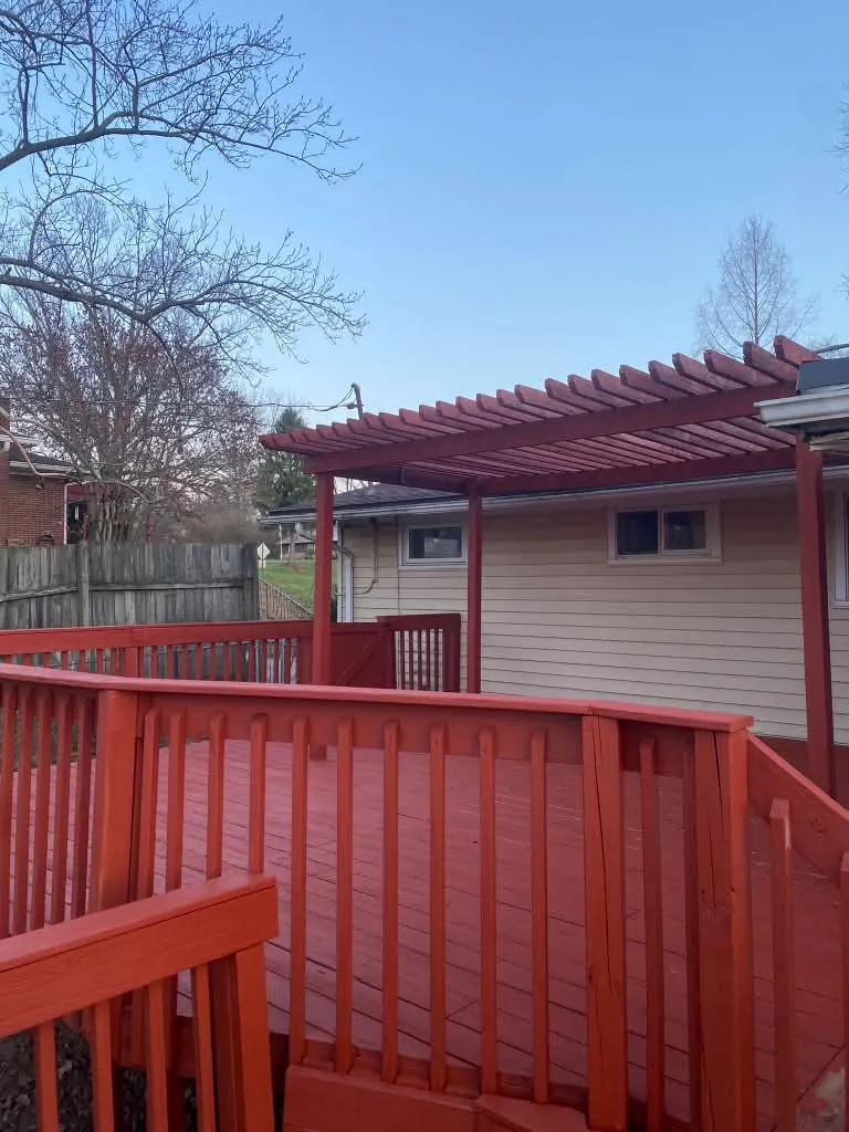 New red deck under the refreshed pergola