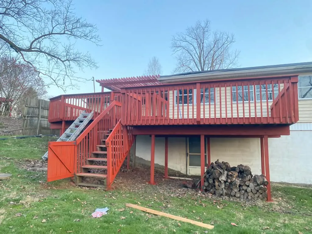 Raised deck and stairs refinished in red