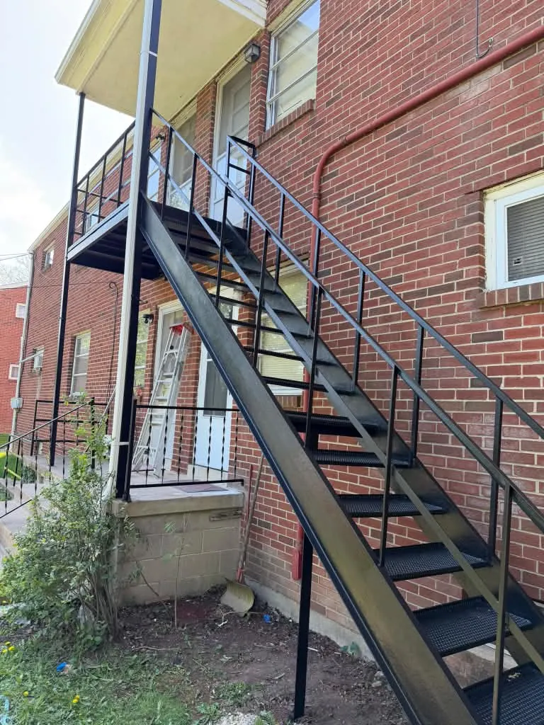 Exterior metal staircase after restoration and repainting